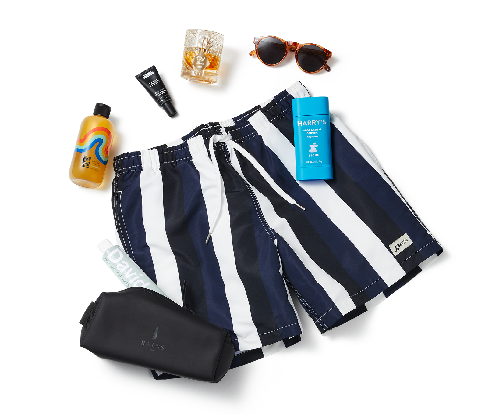 Pair of dark blue and white striped shorts, sunglasses and various makeup products.